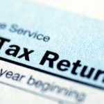 Close-up of a U.S. tax return form showing the words 'Tax Return' in bold text.
